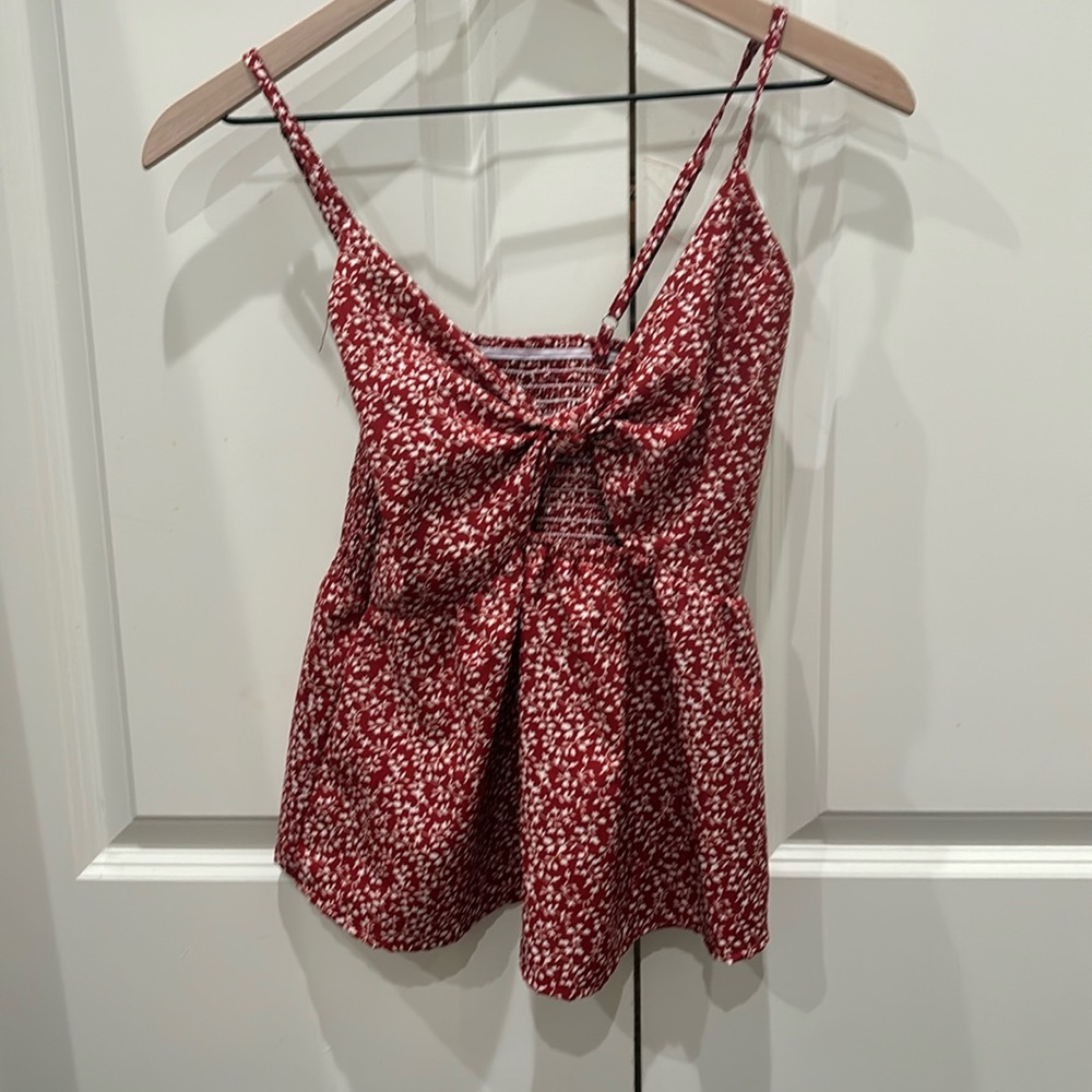 Red floral top with white flowers